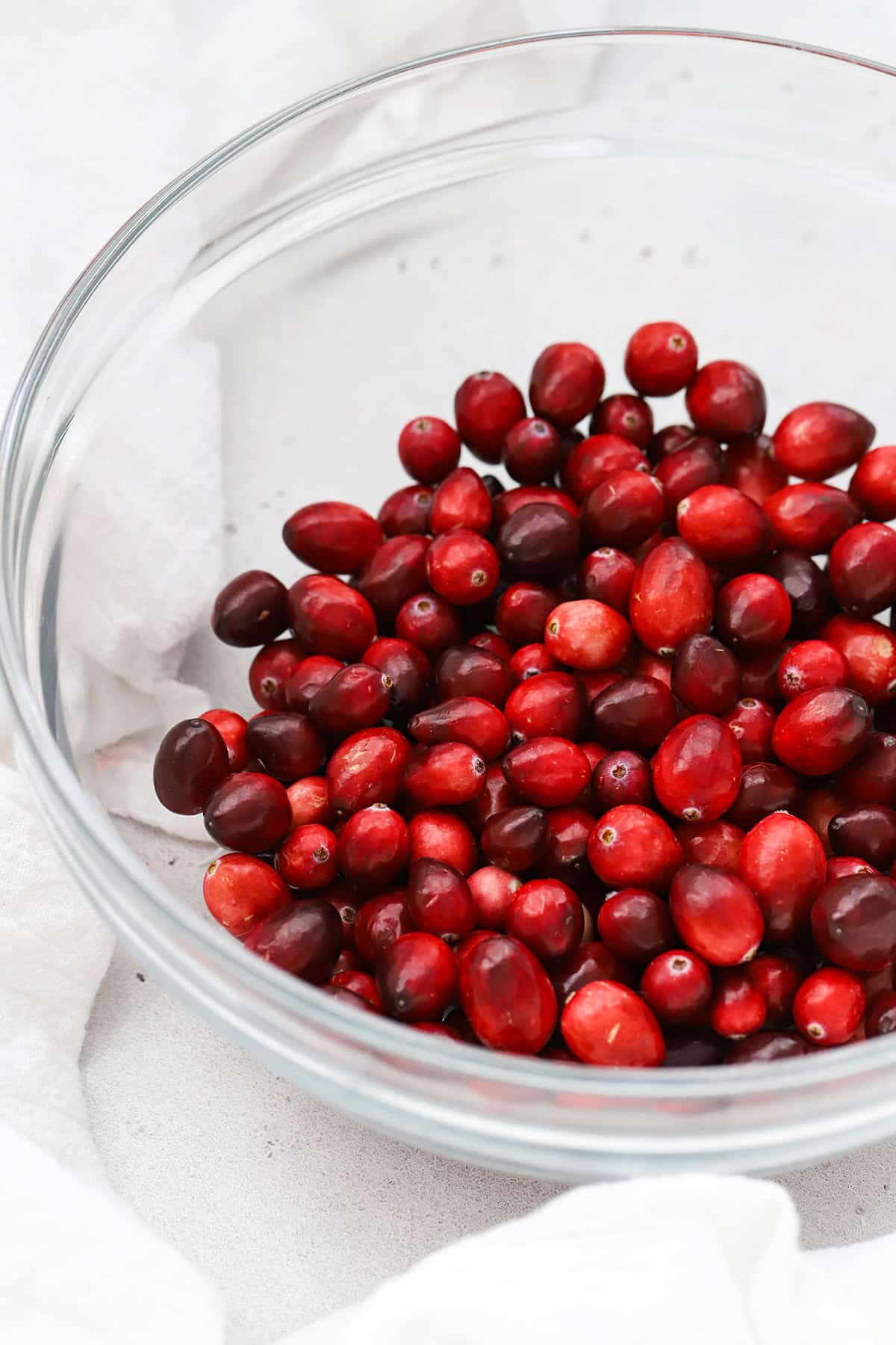 Front view of cranberries in a glass bowl