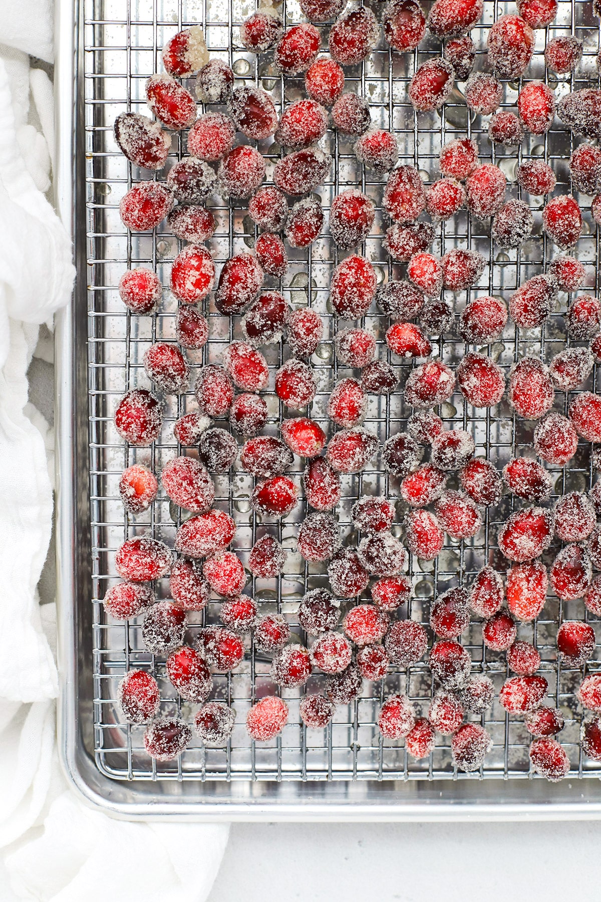 Sugar covered cranberries on a cooling rack