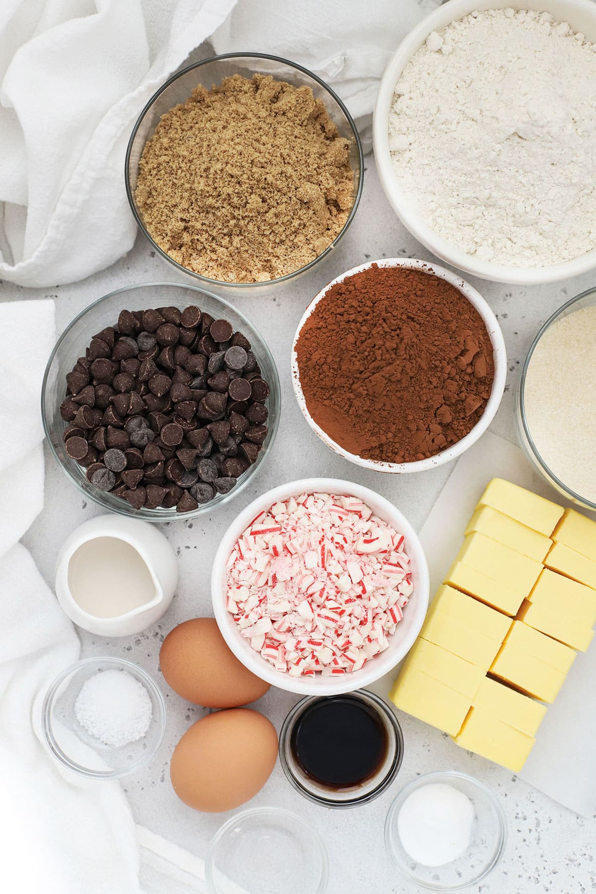 Ingredients for gluten-free chocolate peppermint cookies in small bowls