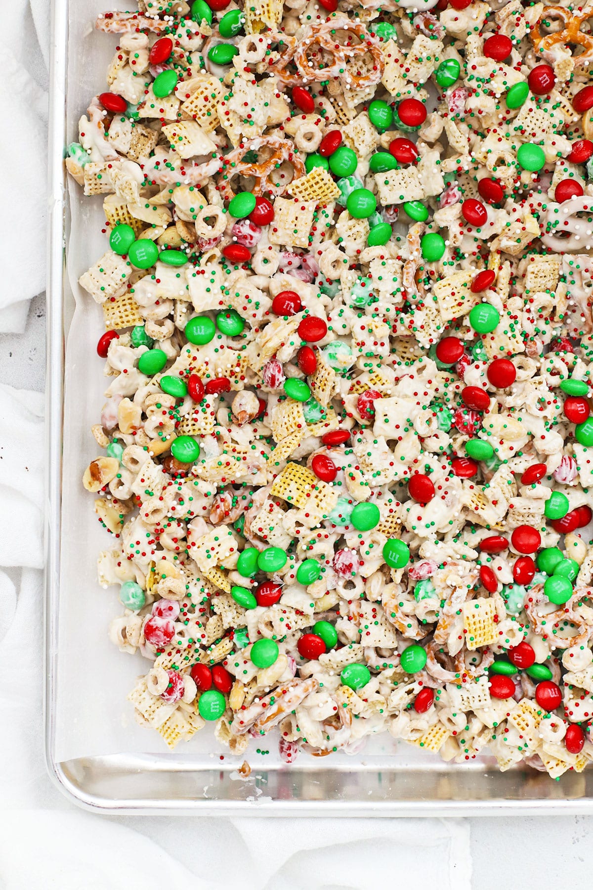A whole pan of gluten-free Christmas chex with m&ms and pretzels