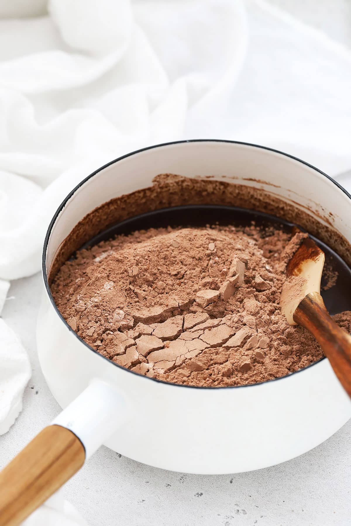 adding dry ingredients to vegan brownie batter