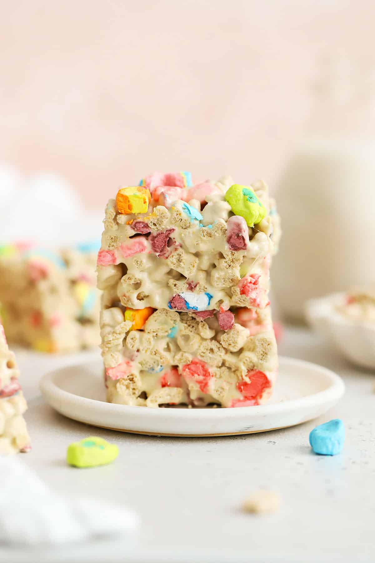 Lucky charms treats stacked on a white plate