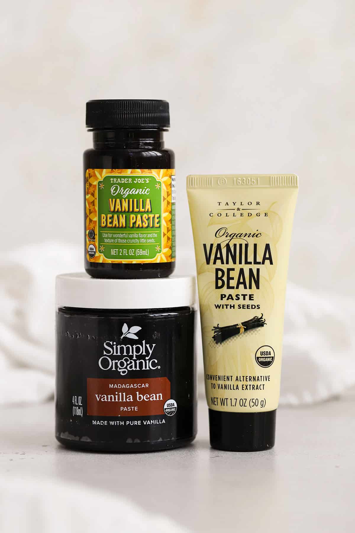 three containers of vanilla bean paste