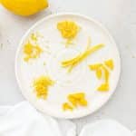 six different sizes of lemon zest on a white plate