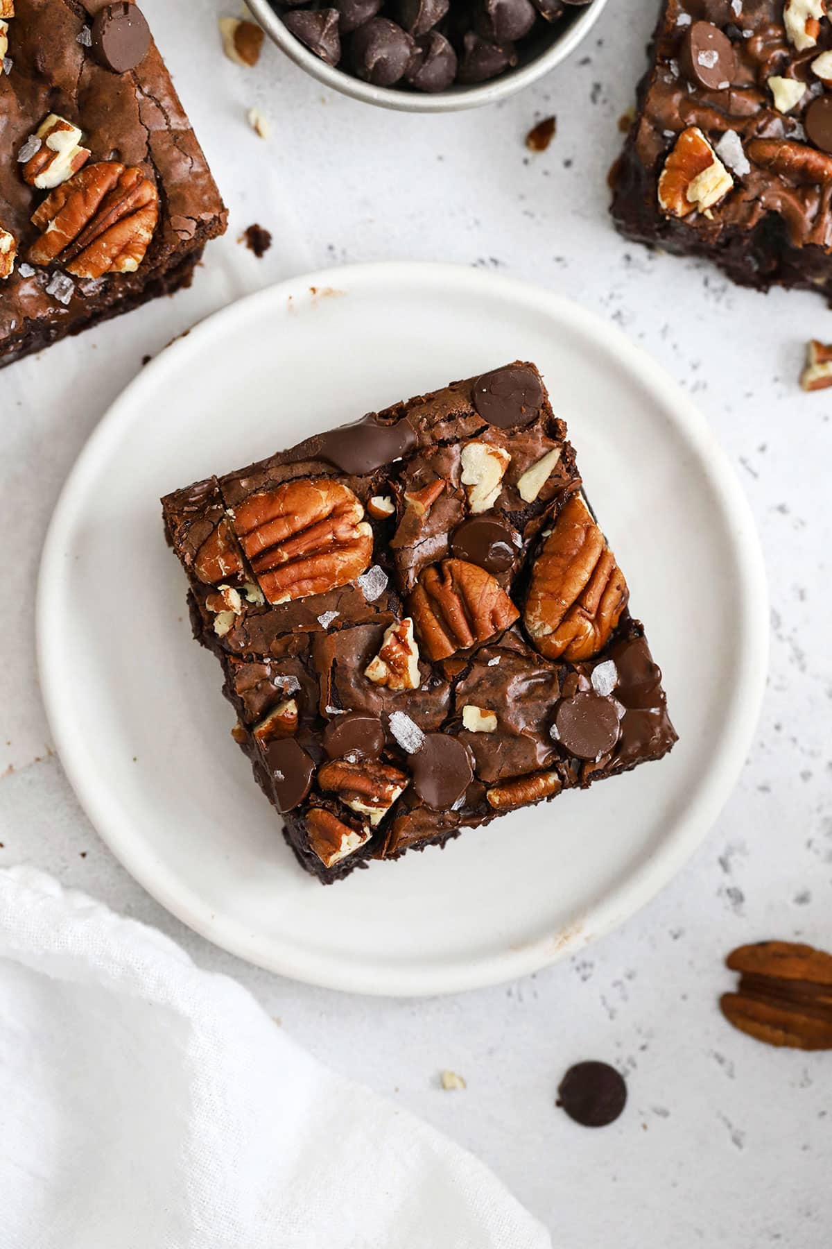 gluten-free pecan brownie on a white plate