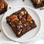 gluten-free pecan brownie on a white plate