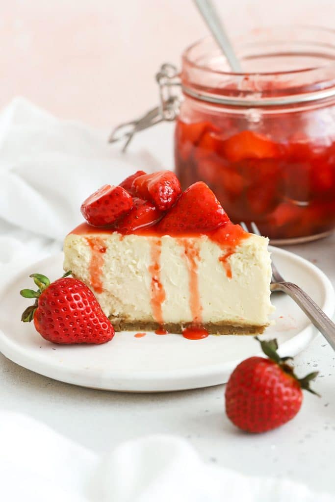 gluten-free strawberry cheesecake topped with strawberry sauce