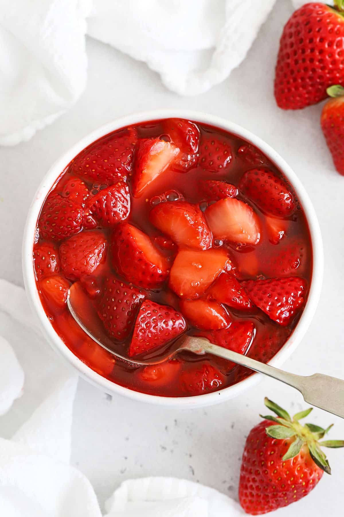 Strawberry topping in a white bowl