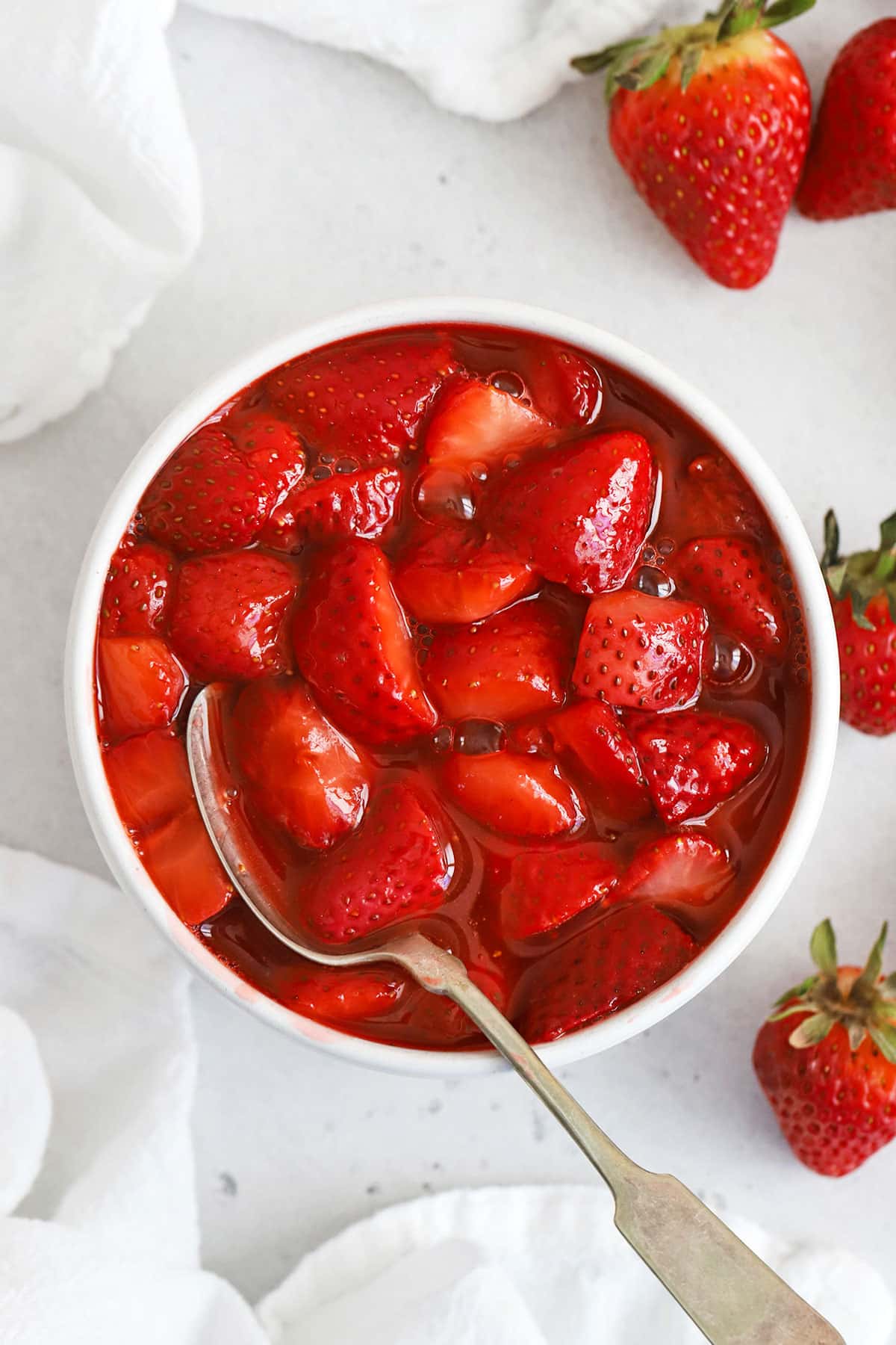 fresh strawberry topping in a white bowl