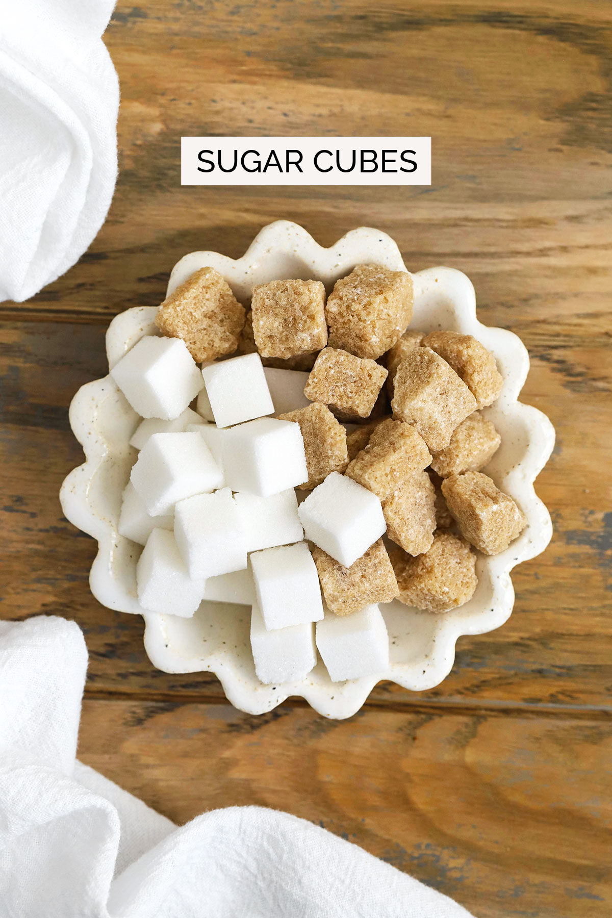 sugar cubes in a ruffled white bowl