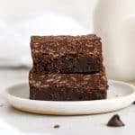 two gluten-free crunch brownies on a white plate