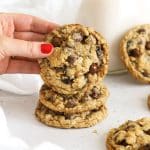 a stack of gluten-free oatmeal raisin chocolate chip cookies on a white background