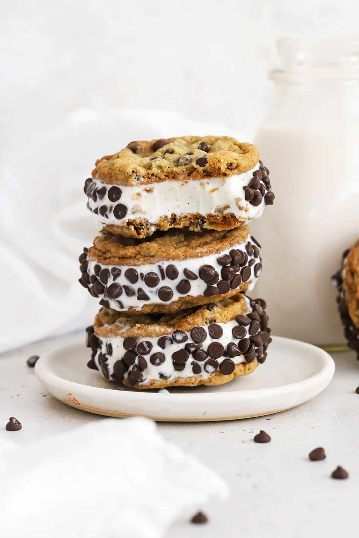 gluten-free cookie ice cream sandwiches stacked on a white plate