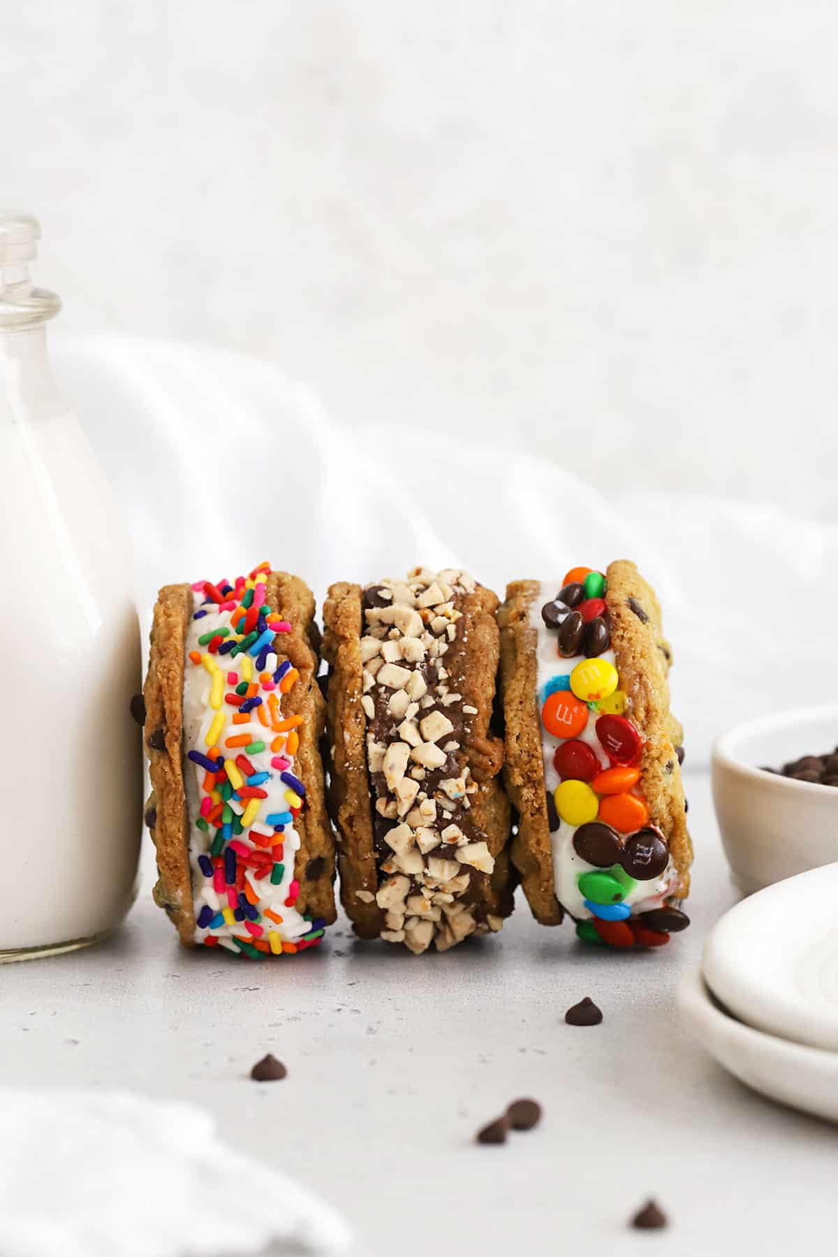 gluten free cookie ice cream sandwiches with fun toppings rolled on the sides