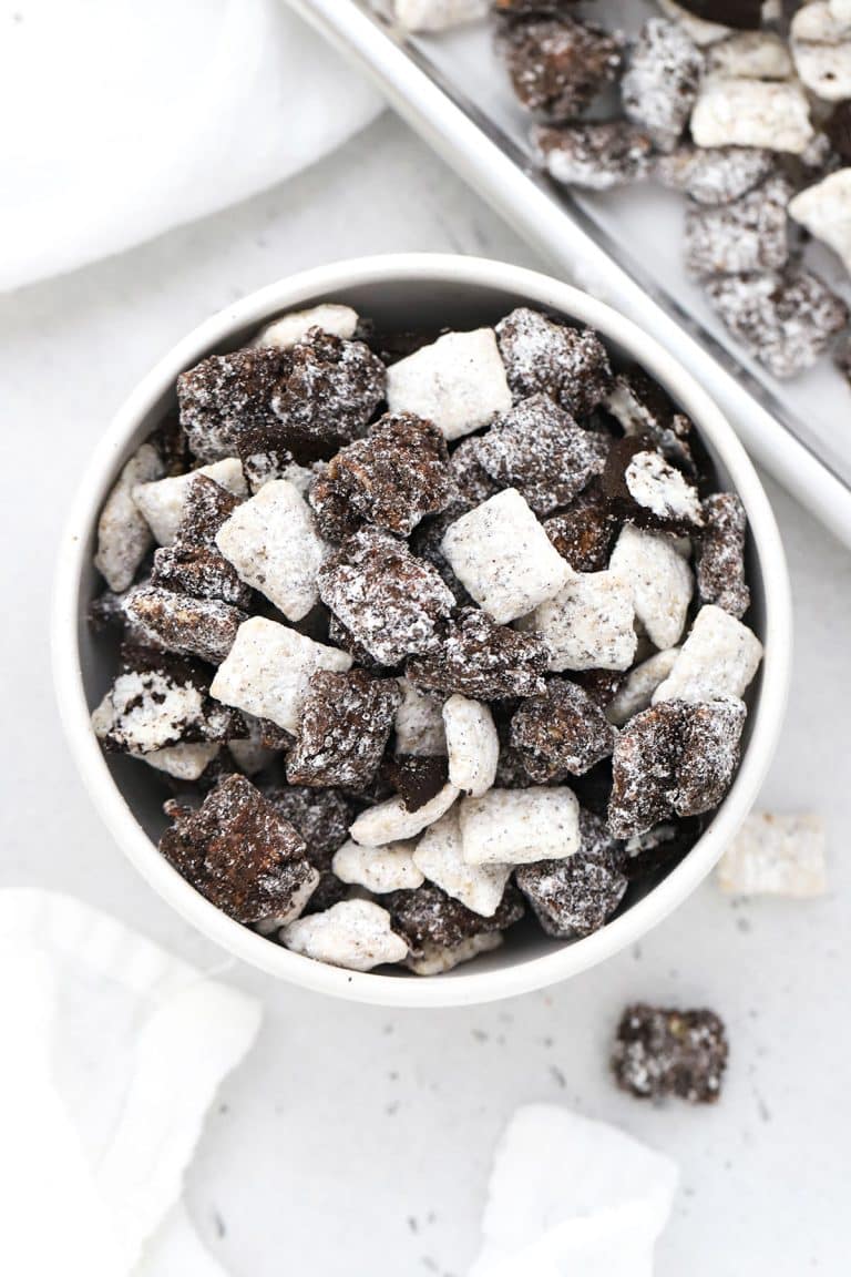 a bowl of cookies and cream muddy buddies with chopped gluten-free oreos