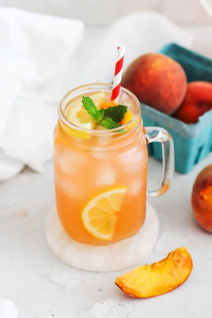 homemade peach lemonade in mason jar glasses
