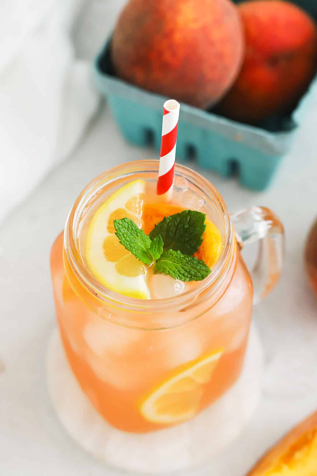 homemade peach lemonade in mason jar glasses