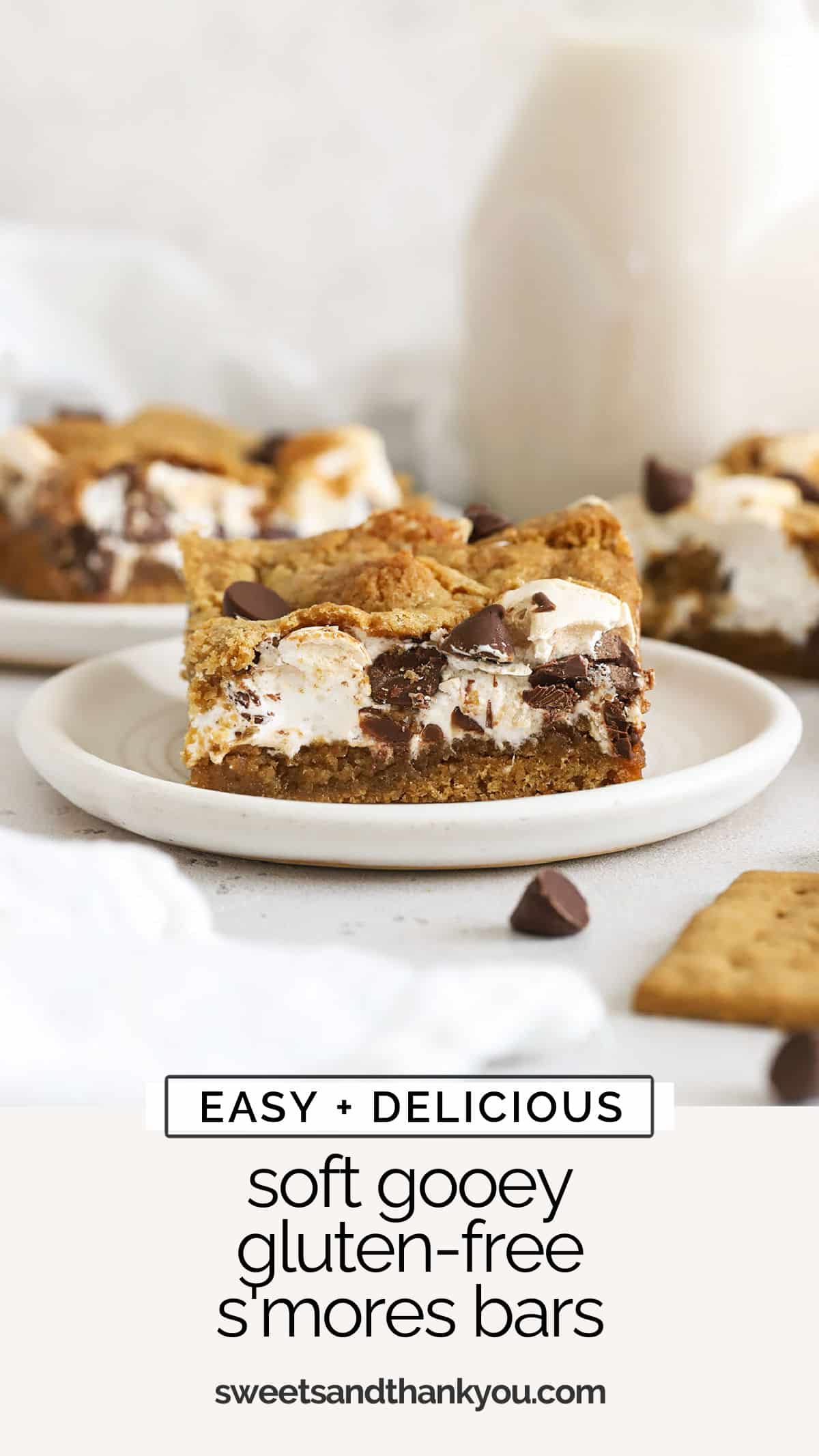 Soft, chewy gluten-free s'mores bars made with gooey marshmallow and melty chocolate between two layers of graham cookie. / gluten free smores bars recipe / gluten free smores cookie bars / gluten-free s'mores cookie bars / gluten-free s'mores recipe / gluten-free cookie bars / gluten-free summer dessert / gluten-free bar recipe /