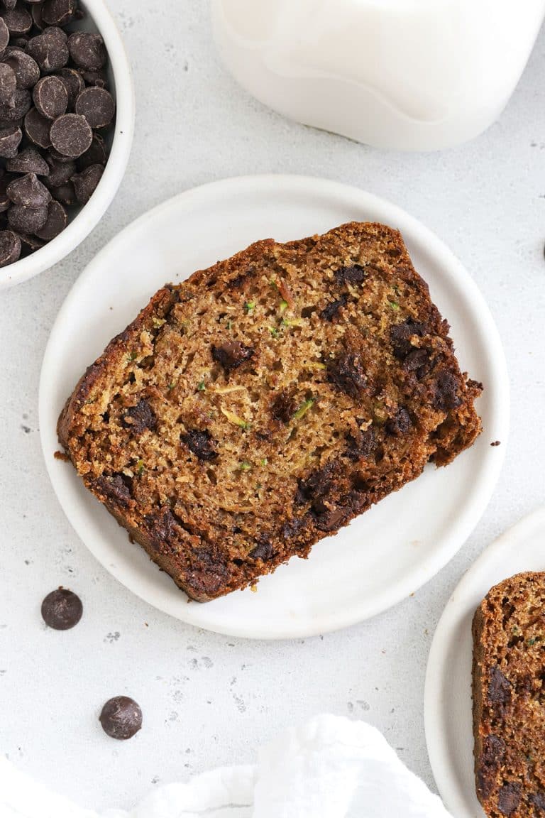 slices of gluten-free chocolate chip zucchini bread on white plates