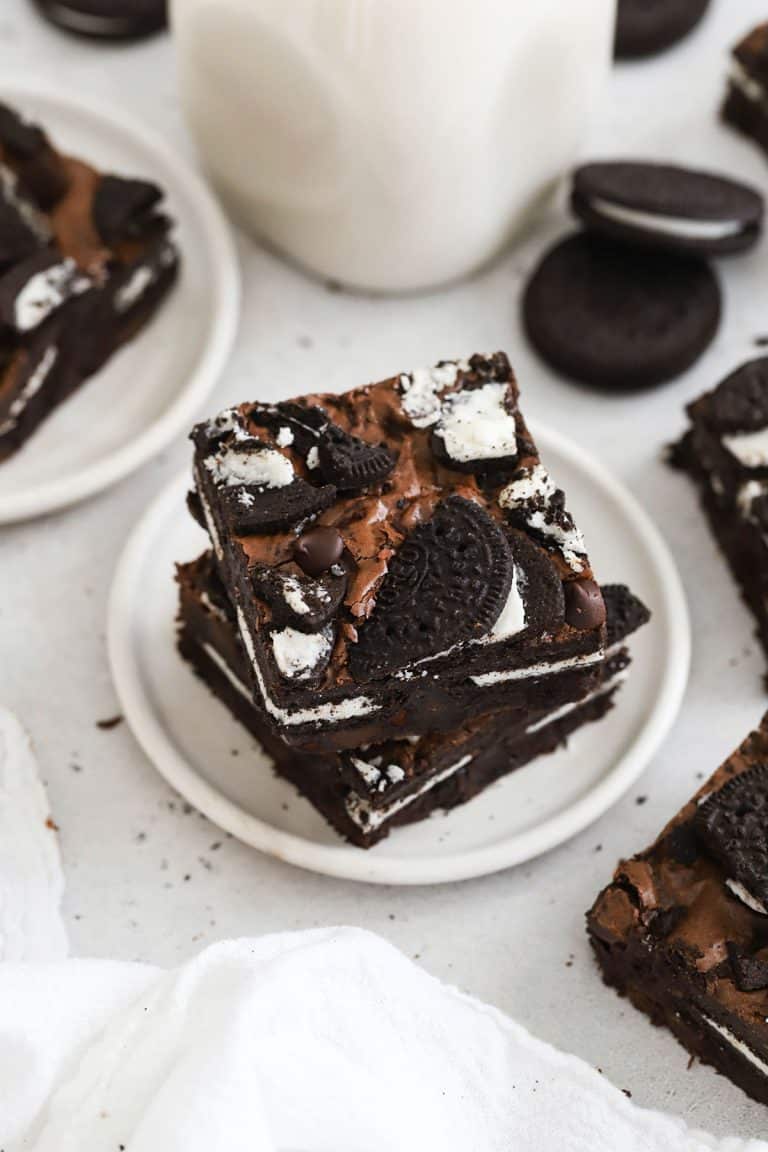 fudgy gluten-free oreos stacked on a white plate