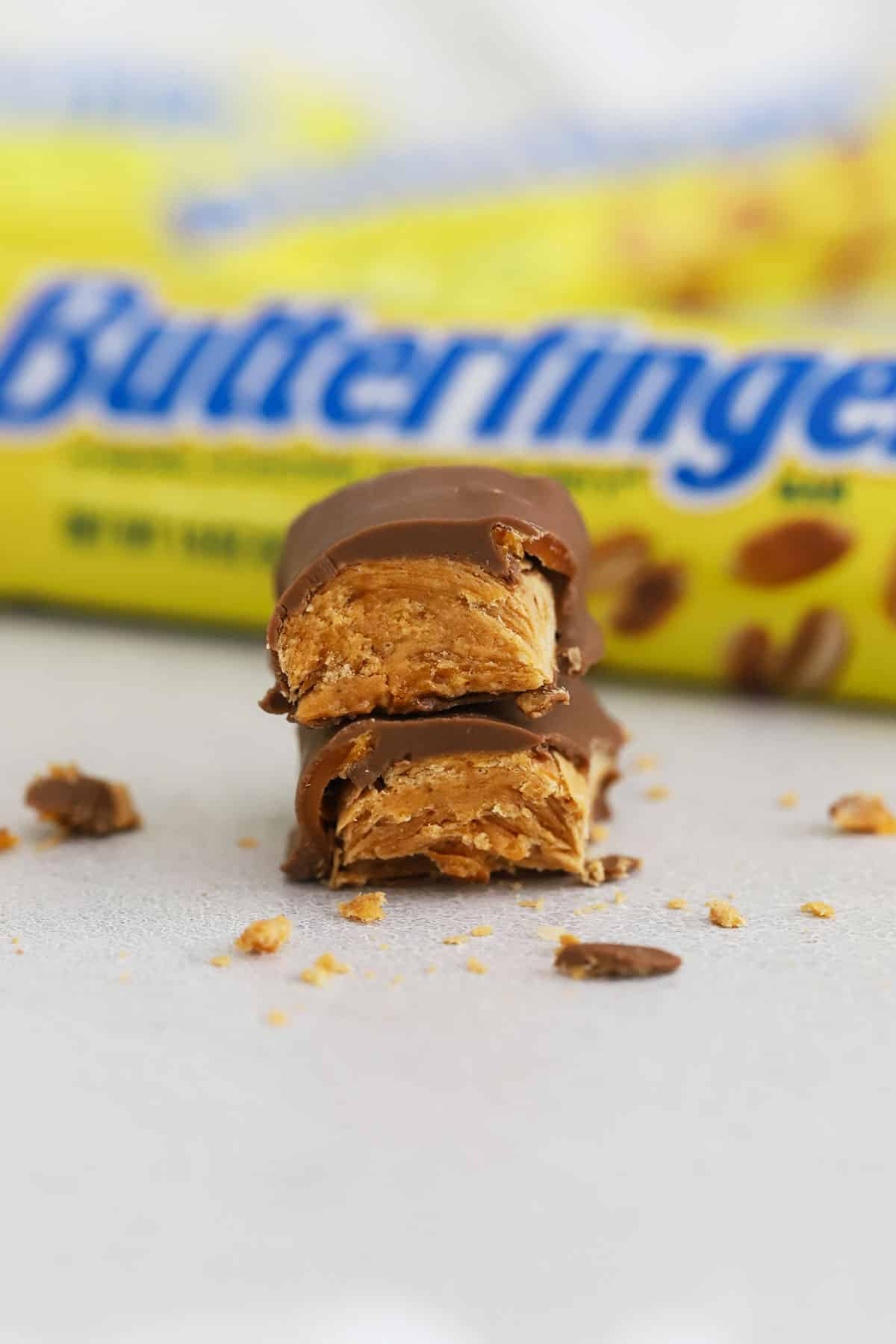 a butterfinger candy bar cut in half and stacked
