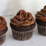 gluten-free chocolate buttercream frosting on gluten-free chocolate cupcakes