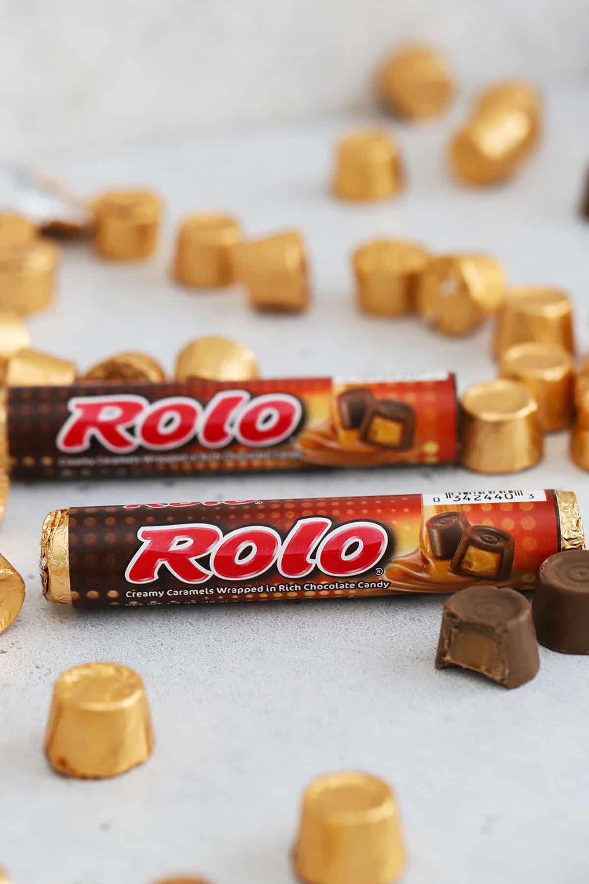 two packages of rolos on a white background with more rolo candy