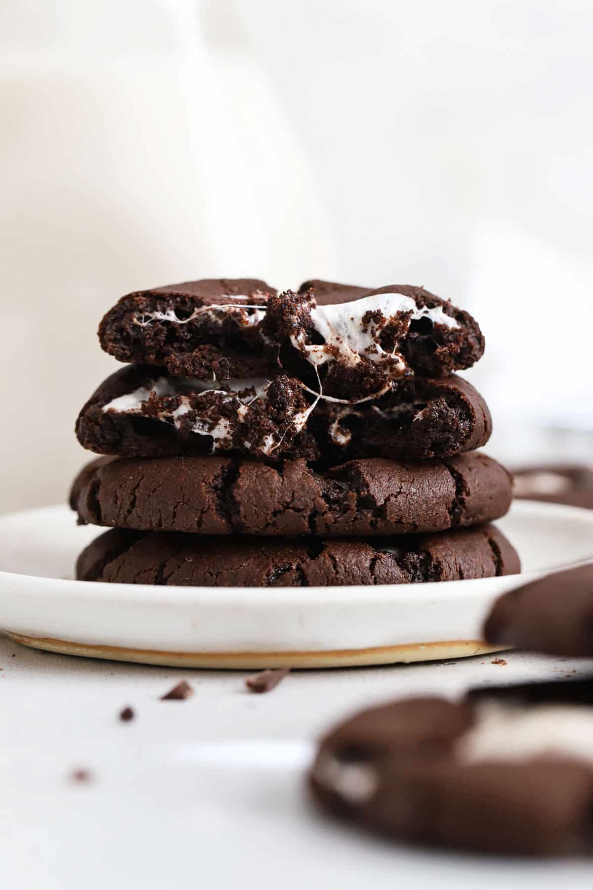 gluten-free hot chocolate cookies stacked on a white plate