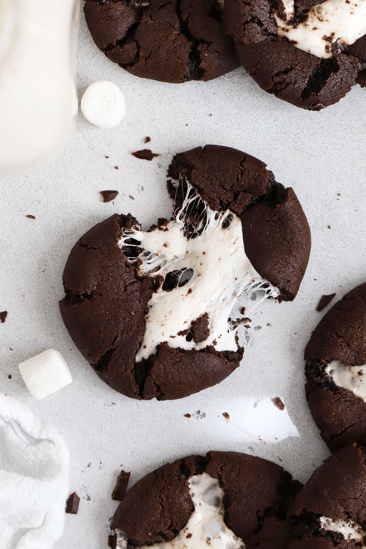 gluten-free hot chocolate cookie being pulled apart to show gooey marshmallow center