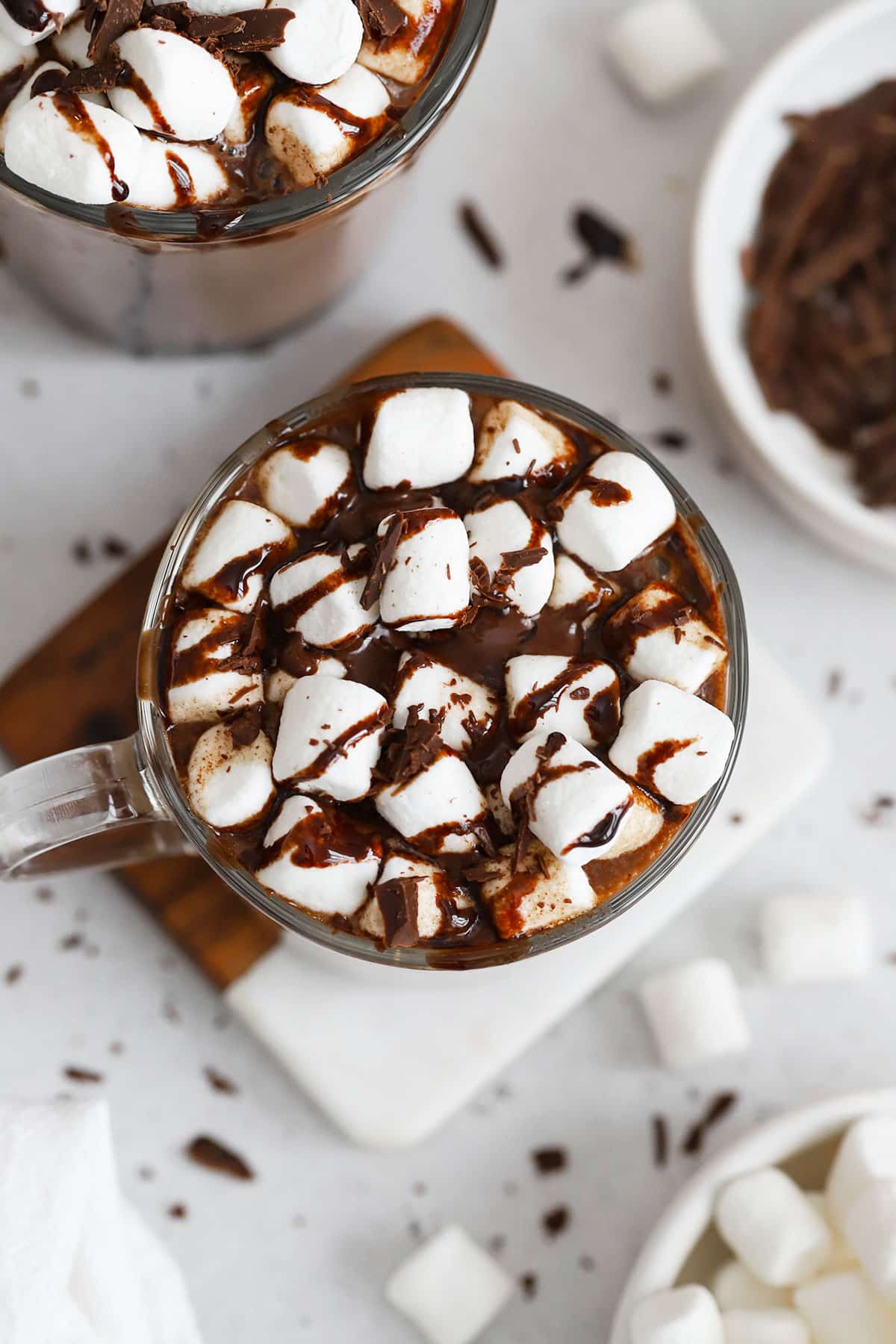 homemade hot chocolate topped with marshmallows and chocolate syrup