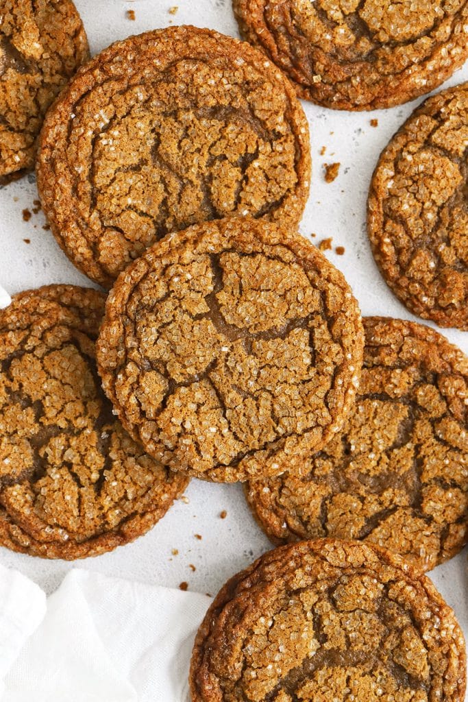 chewy gluten-free molasses cookies on a white background