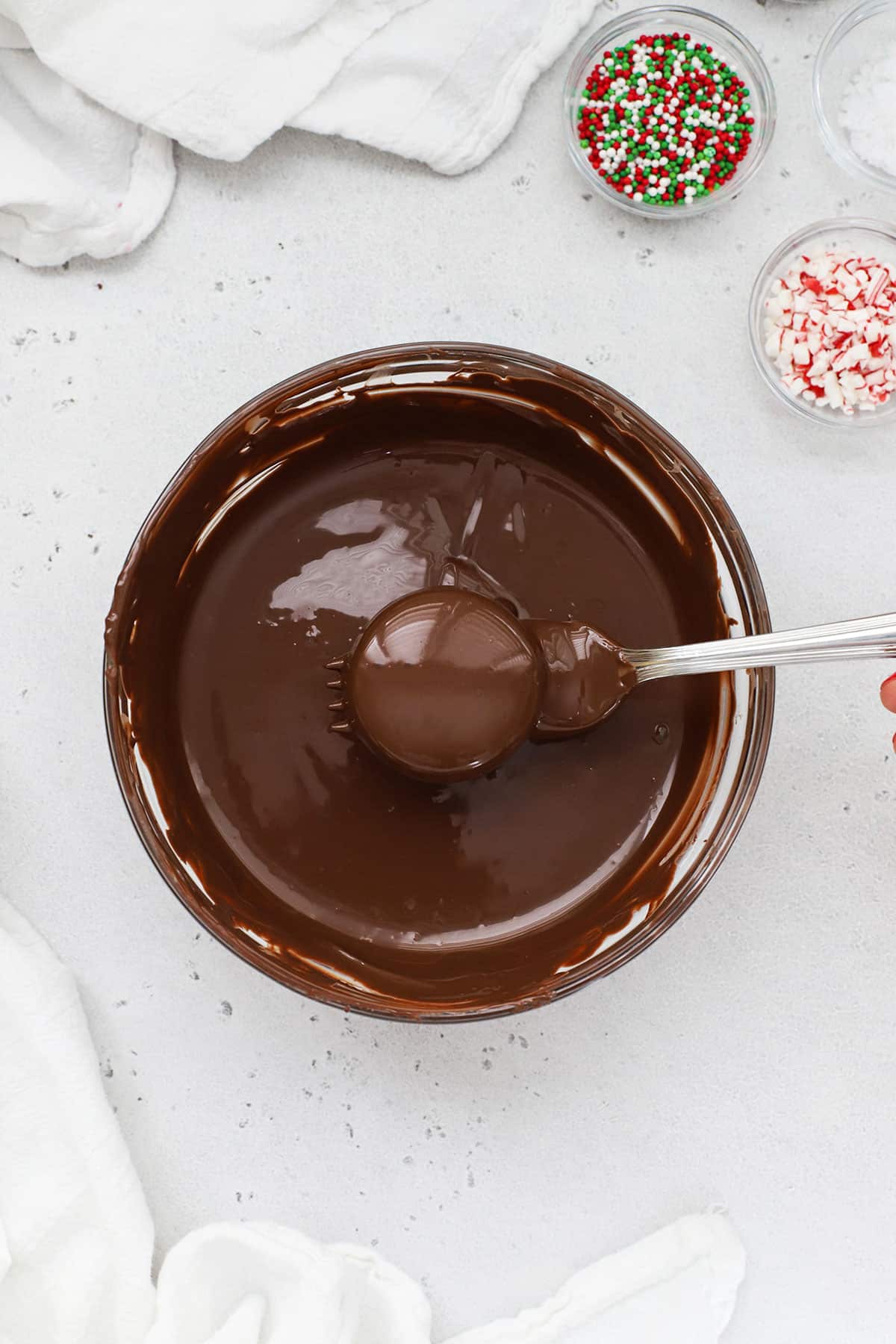 dipping gluten-free Oreos in chocolate candy melts