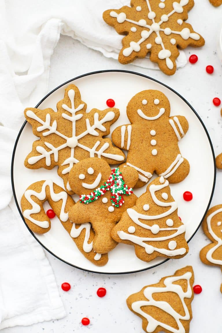 gluten-free gingerbread cookies shaped like gingerbread men, snowflakes, christmas trees, and candy canes
