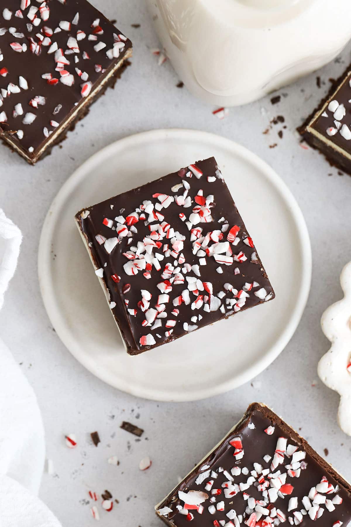 squares of gluten-free peppermint brownie on a white background