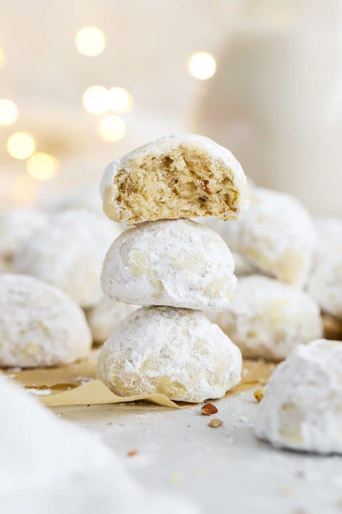 gluten-free snowball cookies stacked in a column