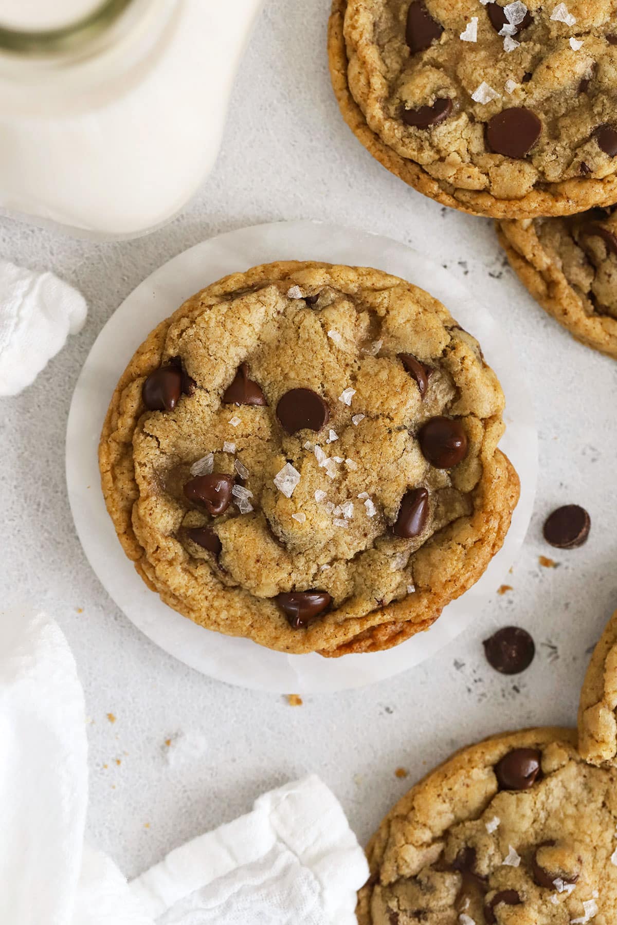 gluten-free chocolate chip cookies with a jar of milk