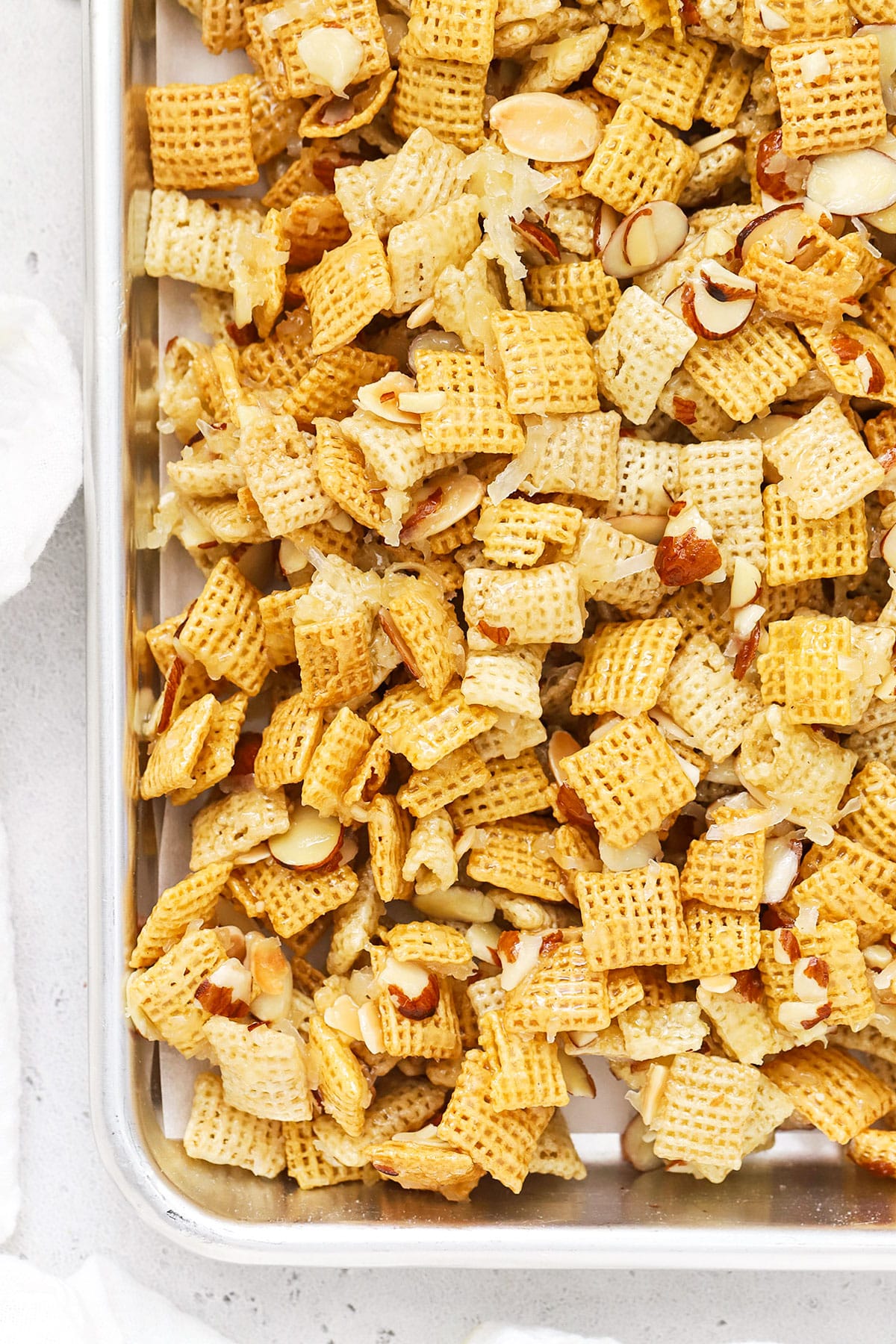 sheet pan of gluten-free sweet chex mix cooling