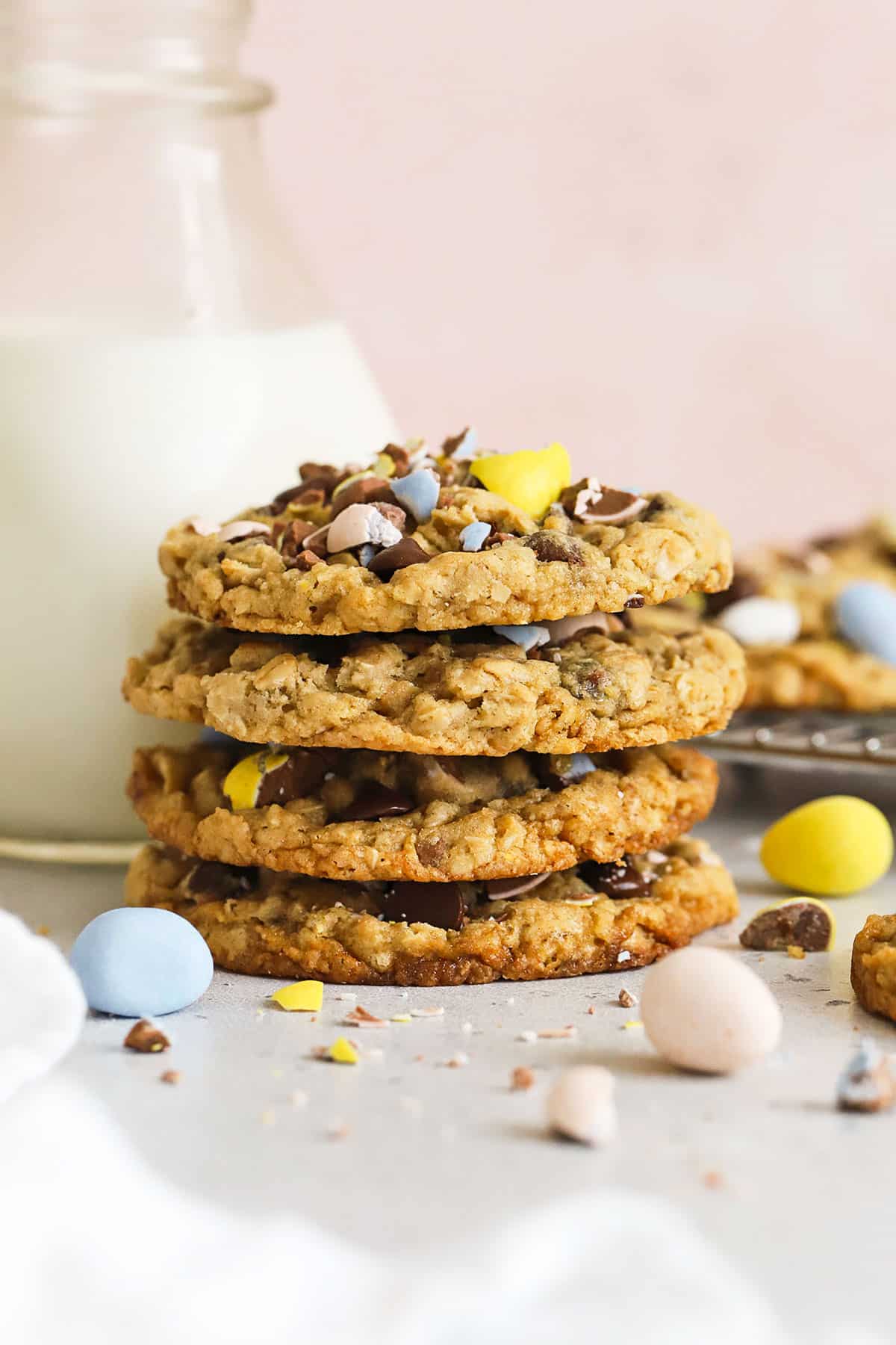 gluten-free cadbury mini egg cookies in a stack with a bottle of milk