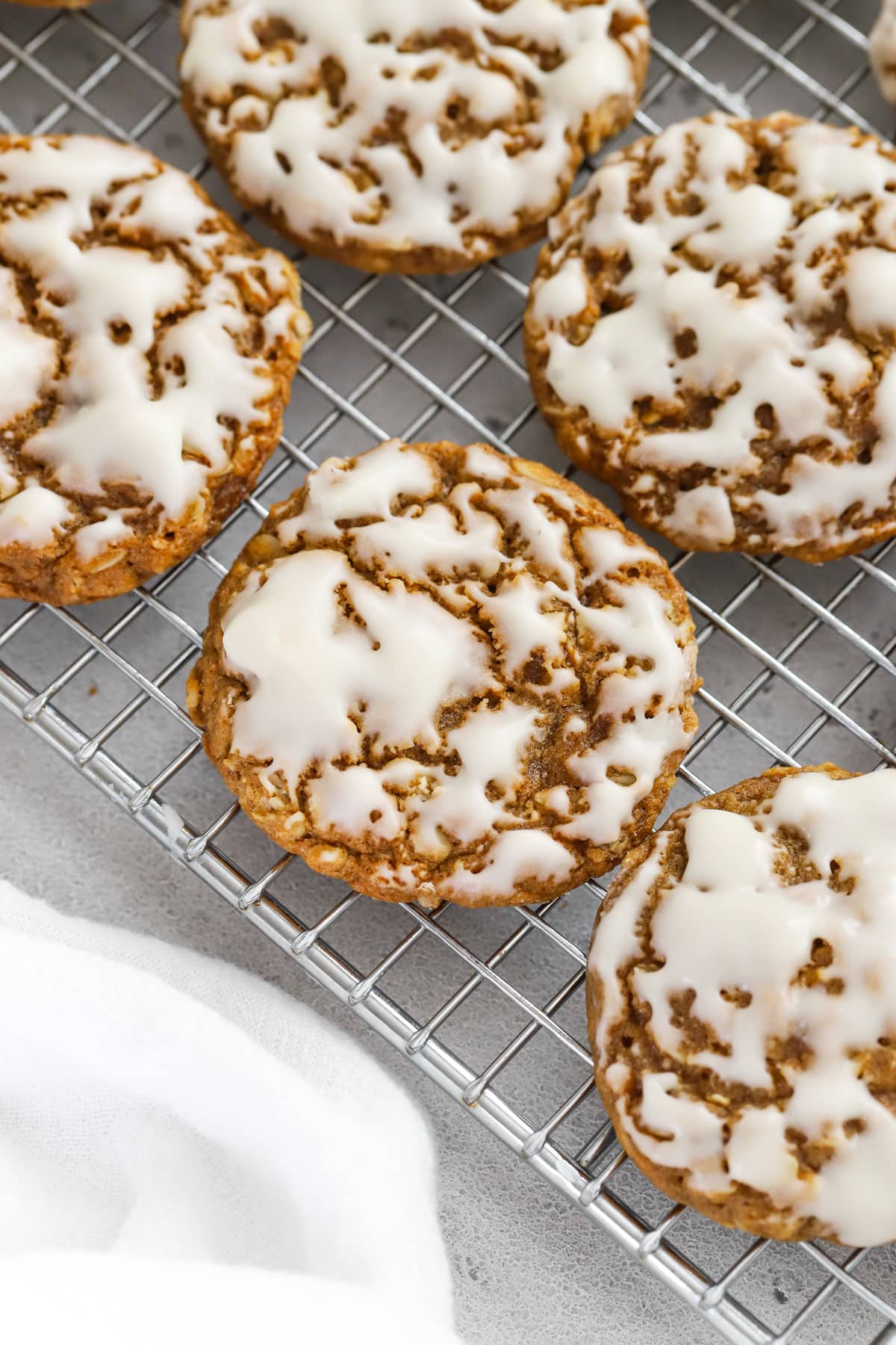 Gluten-Free Gingerbread Oatmeal Cookies dipped in vanilla glaze