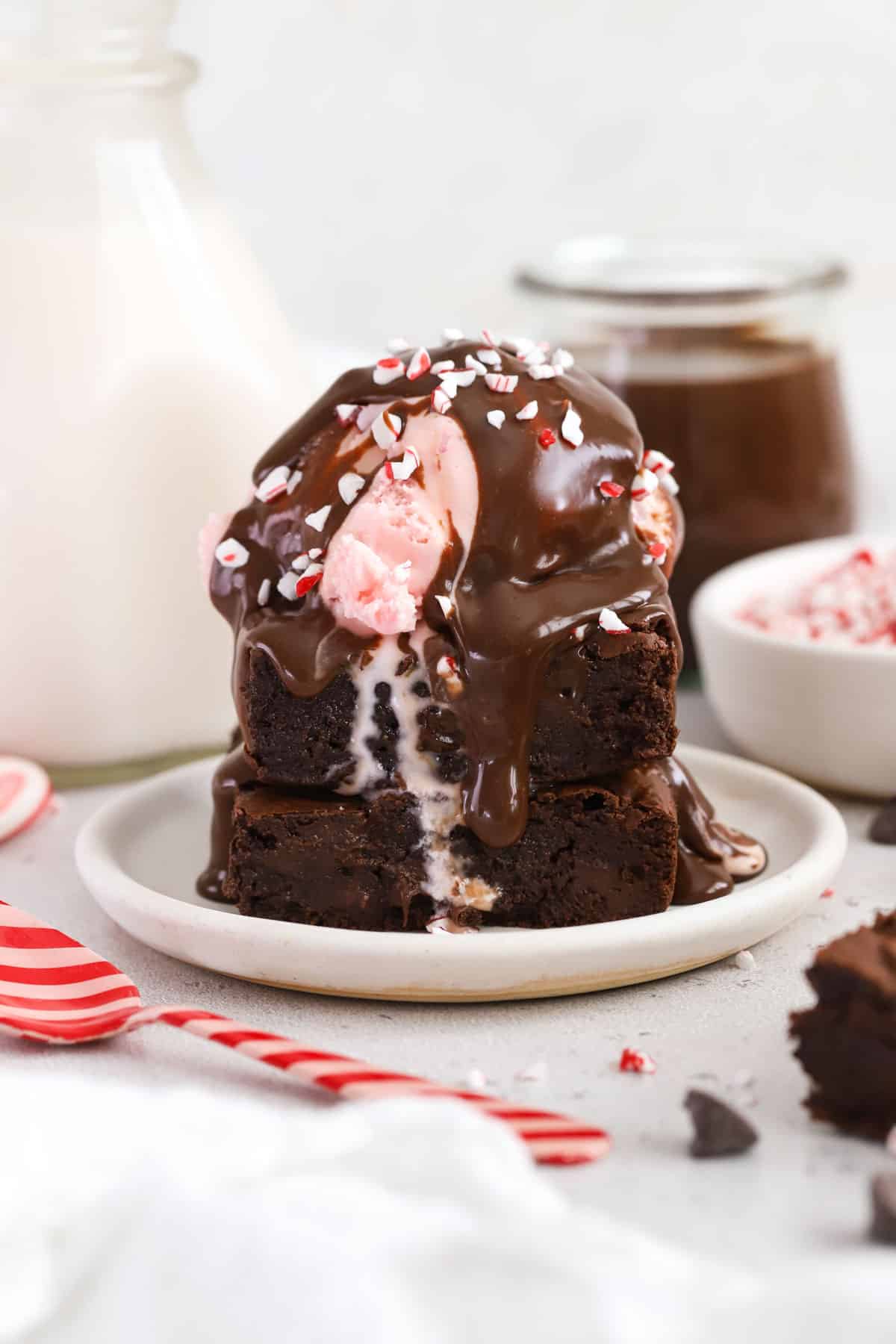 Peppermint hot fudge sauce on a peppermint brownie sundae