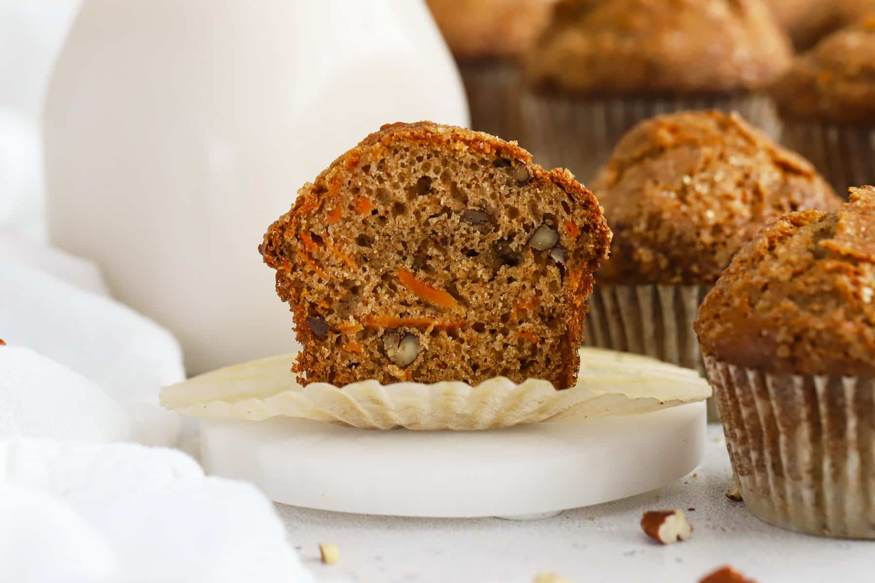 A gluten-free carrot cake muffin cut in half
